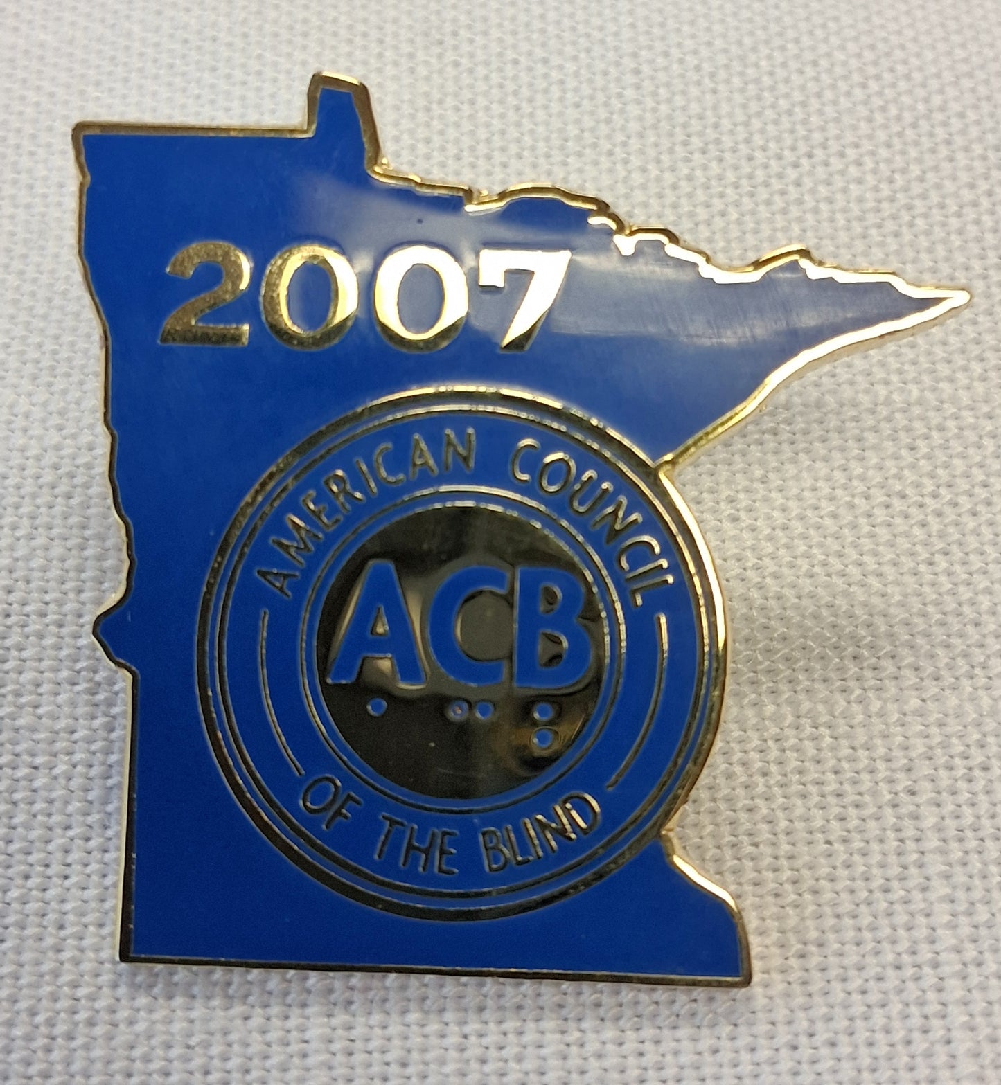 Blue and gold pin with '2007' and 'American Council of the Blind' logo on a white background