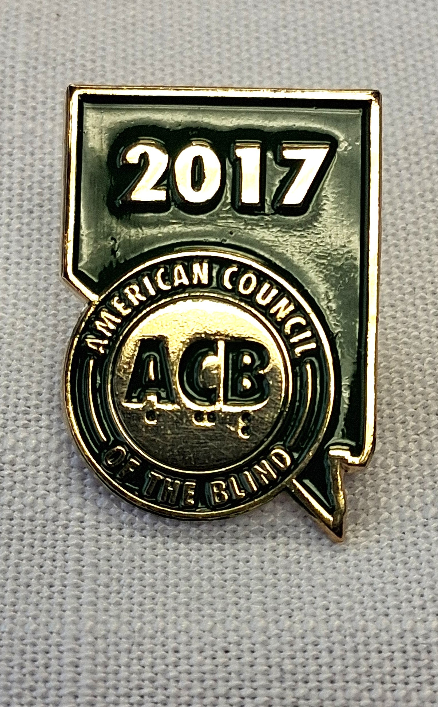 Gold badge with '2017' and 'American Council of the Blind' logo on a gray background