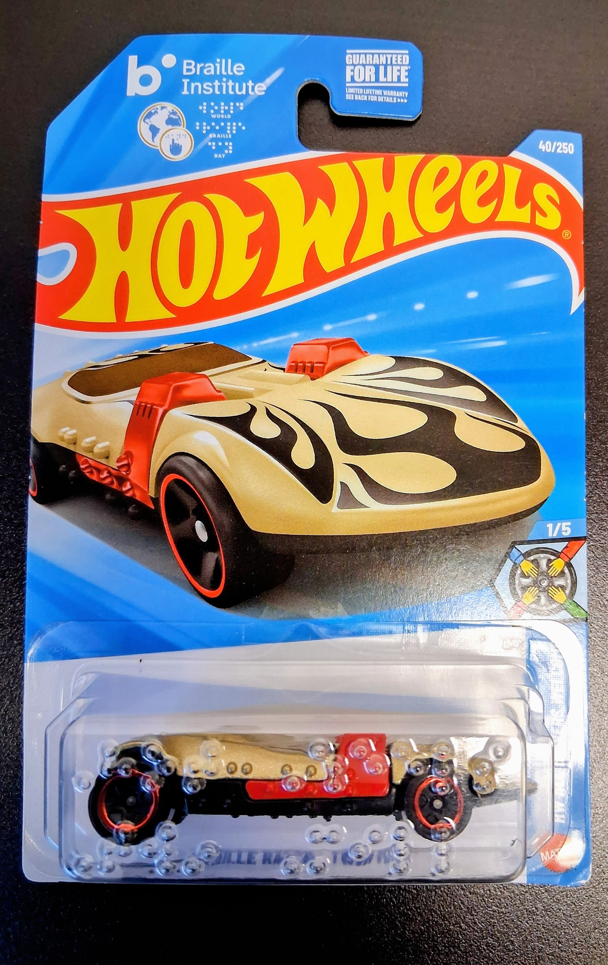Hot Wheels toy car in packaging with Braille Institute label
