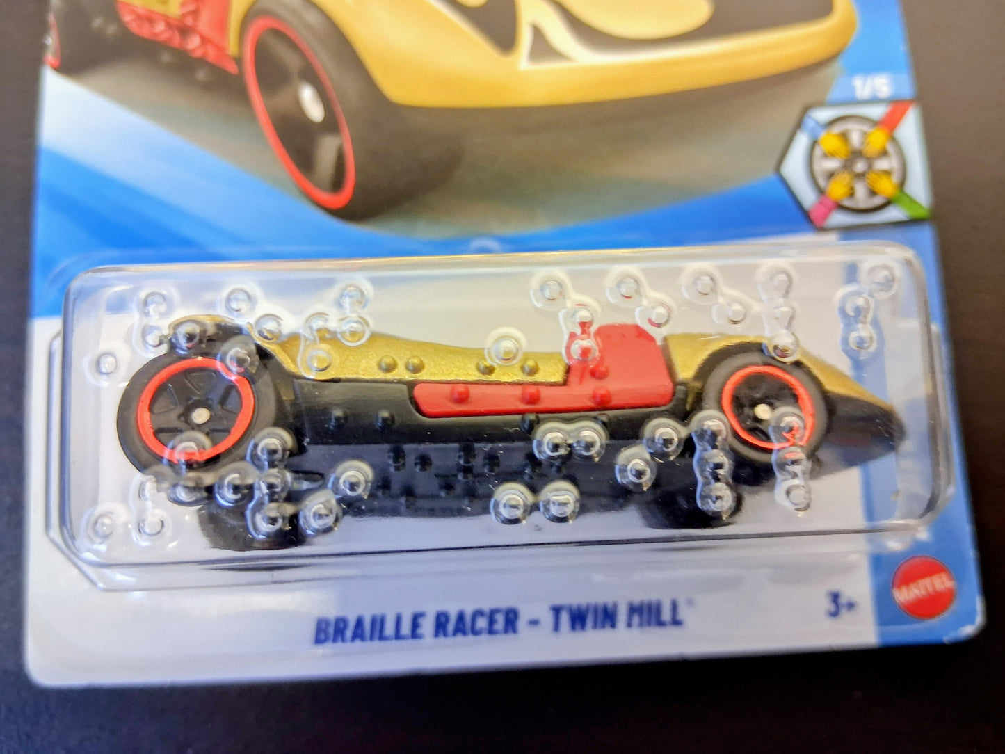 Toy car with 'Barrillte Racer' branding on a clear plastic card.