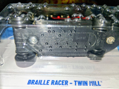 Metallic engine block with 'Braille Racer - Twin Mill' branding on a reflective surface.