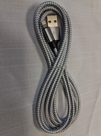 Coiled, Apple, USB cable on a gray textured surface
