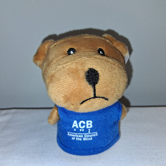 Plush bear toy with a blue shirt displaying 'ACB' on a white background
