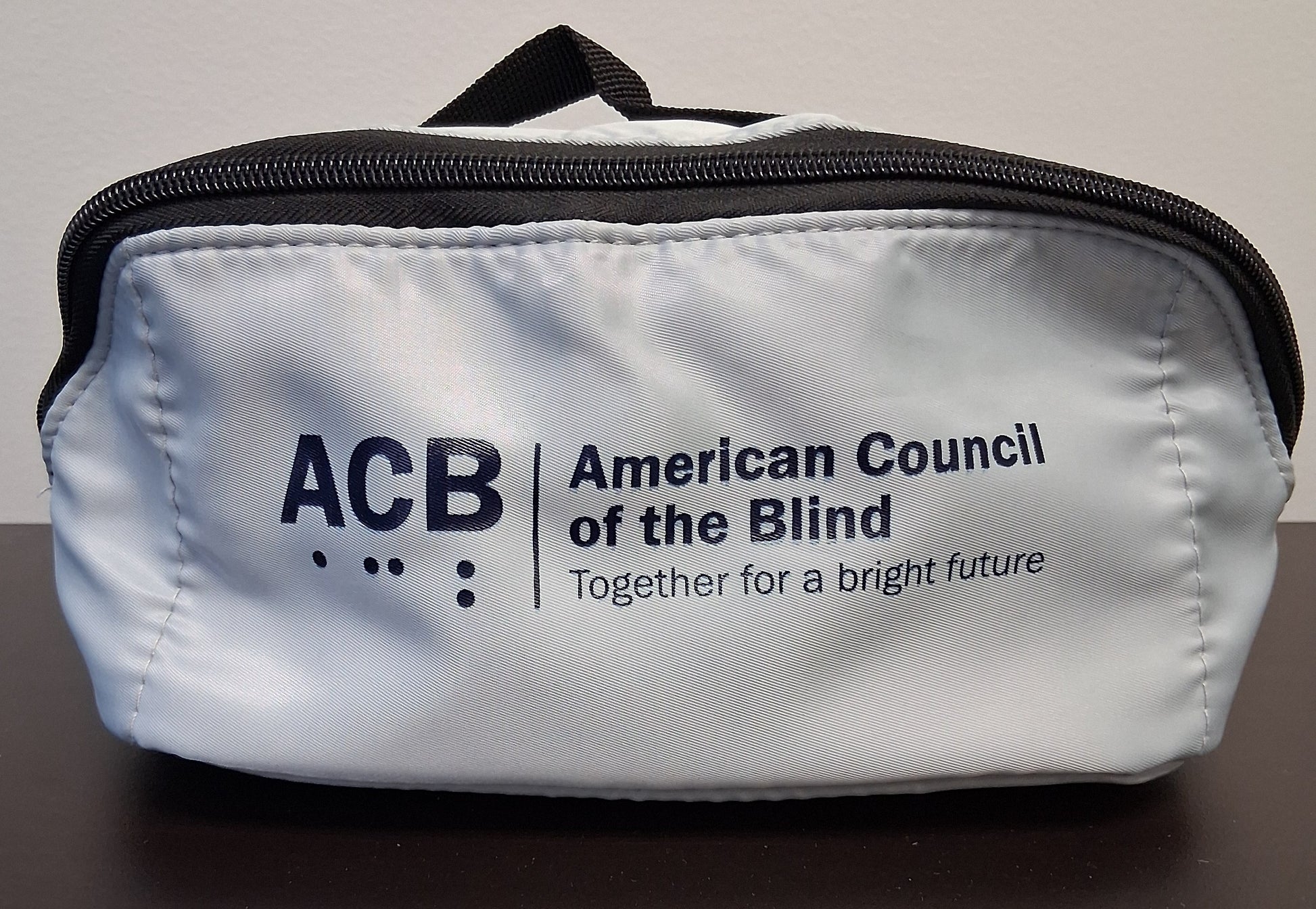 Gray travel with the American Council of the Blind logo and tagline printed in Navy on the front.