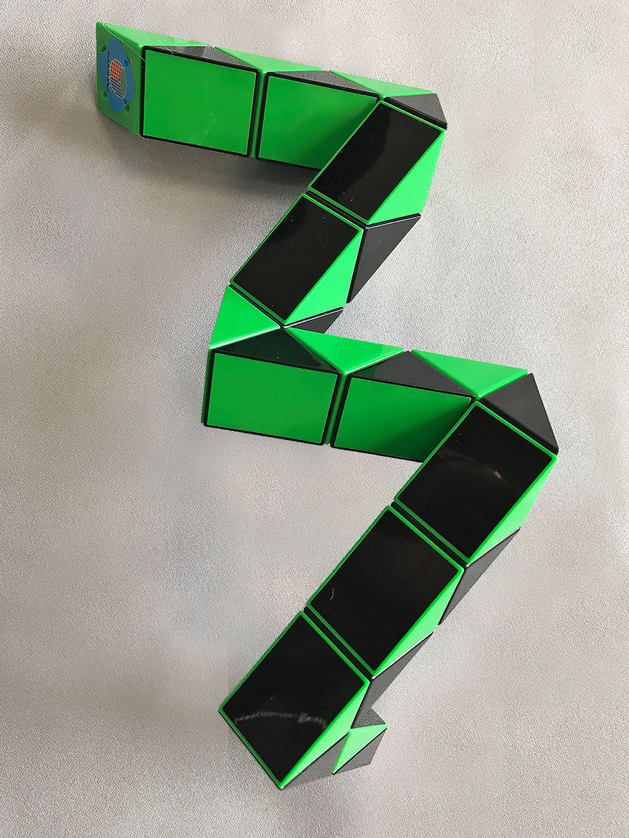Green and Black Puzzle in a Snake Shape