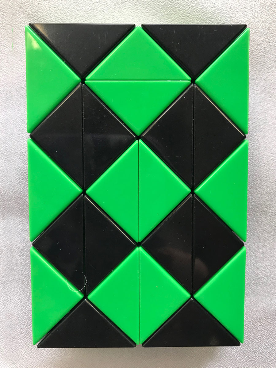 Green and Black Puzzle in a Rectangle Shape