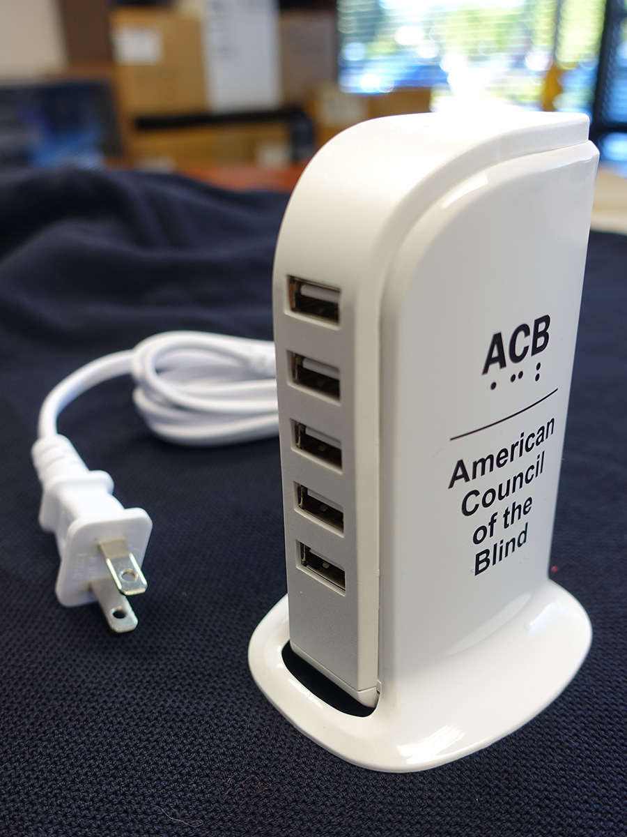 White charger with cord on table