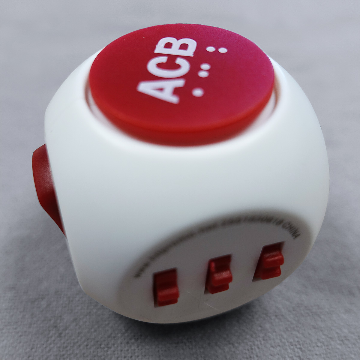 Red and white spinning fidget cube