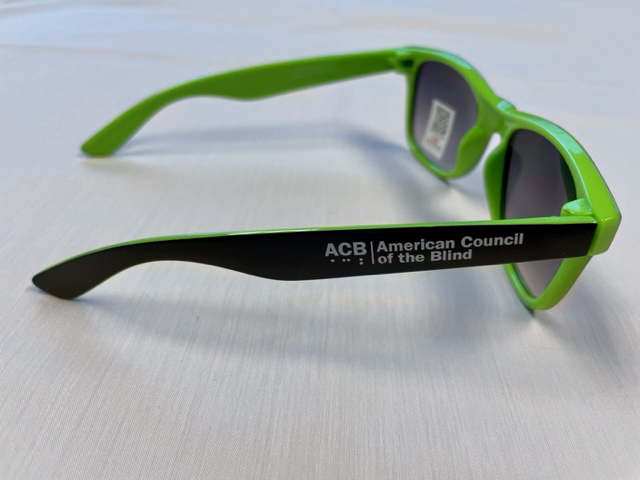 Sunglasses with green and black trim - side view