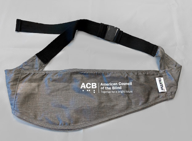 Front view of heather gray sling bag with white ACB logo and black strap