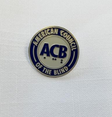 Gold and Black metal lapel pin with ACB logo