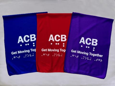Group of towels in three color options: blue, red and purple